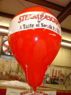 Hot-air shape helium balloon with Steak Escapes logo