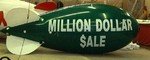 Advertising Blimp - Million Dollar Auto Dealer Lettering